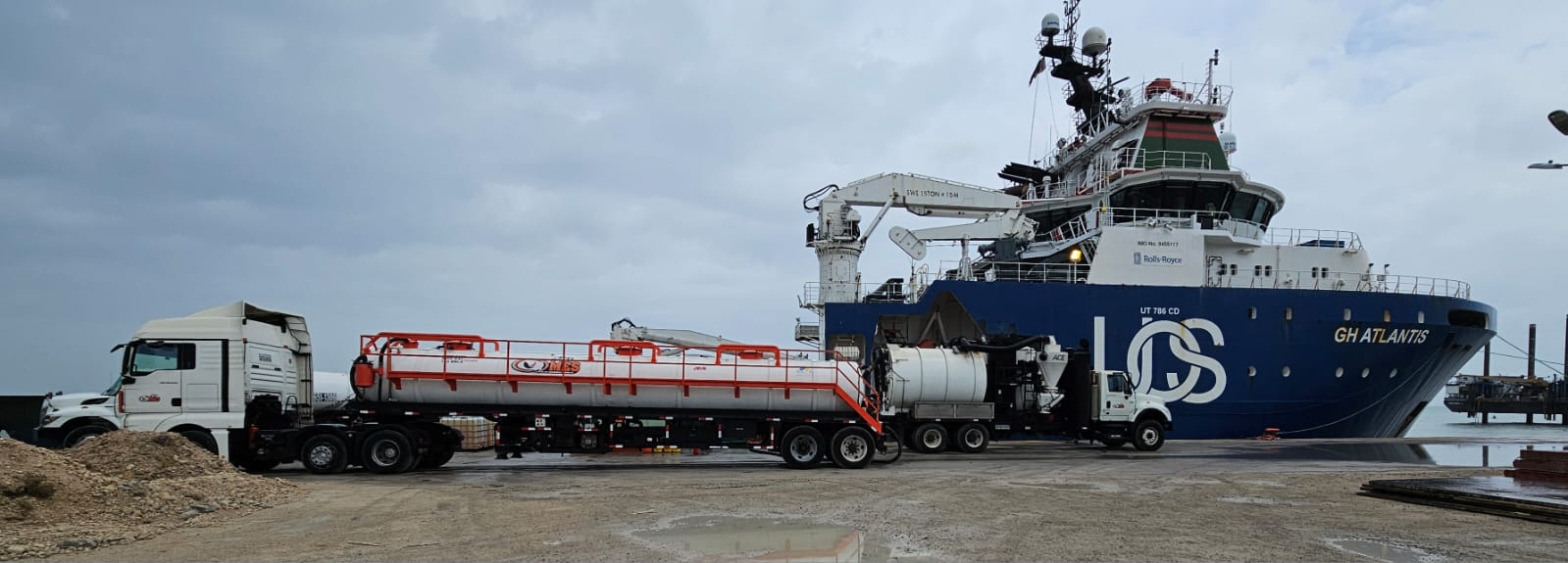 Oil Mop tanker providing waste services beside an offshore support vessel